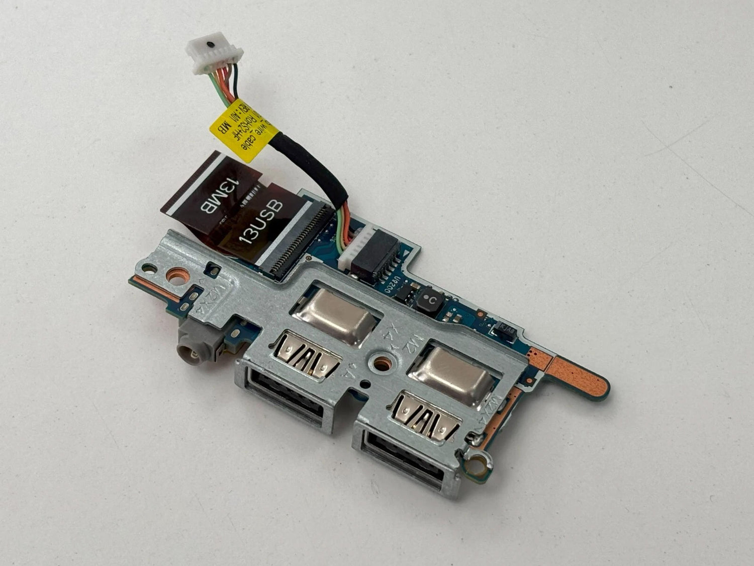 A HP I/O board on a grey background.