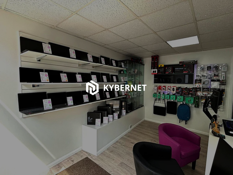 Kybernet store with shelves displaying various items, a purple and black chair, and a 'Kybernet' logo.