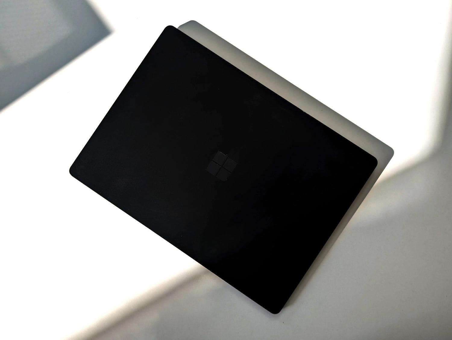 Microsoft Surface Laptop on a white surface